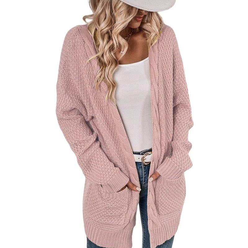 Ladies Large knitted cardigan with an elaborate stitch pattern and practical pockets Lune London