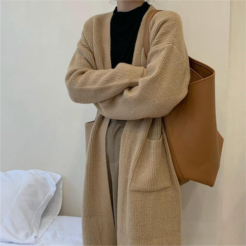 Manteau tricoté pour femmes avec ouvertures et poches spacieuses Chic & Stil