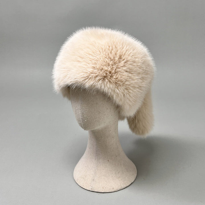 Women’s plush faux fur trapper hat with earflaps and decorative tail Amarae