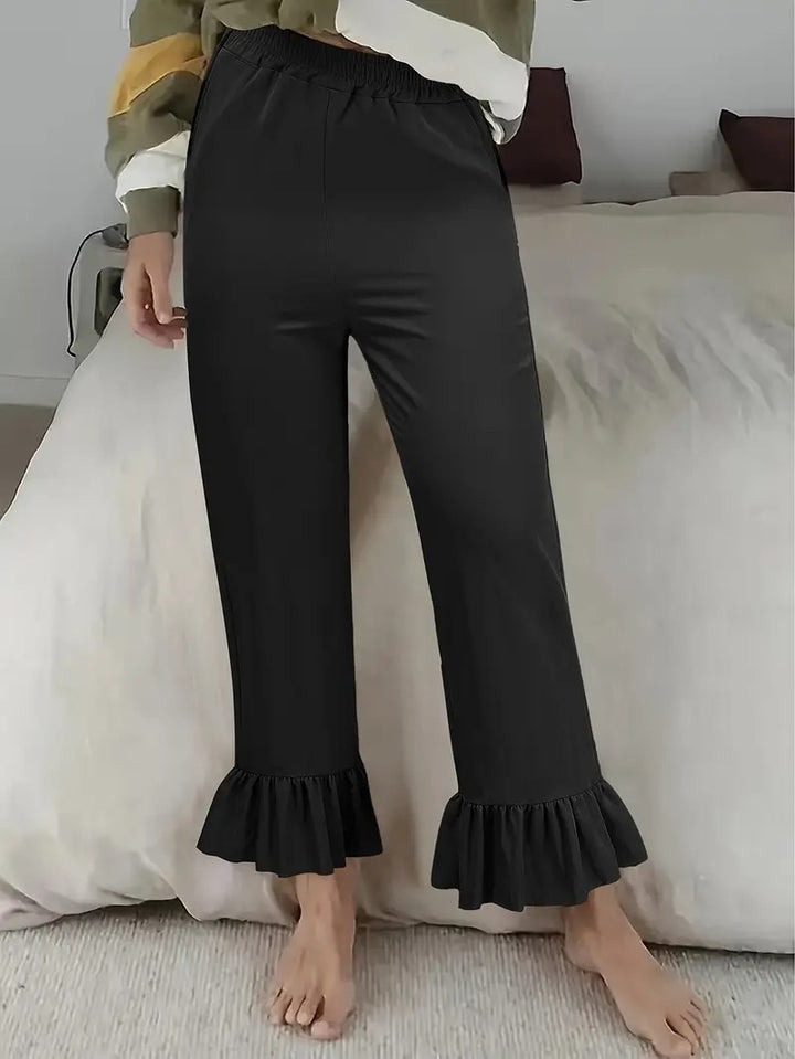 Women's flared pants with playful ruffle details Lune London