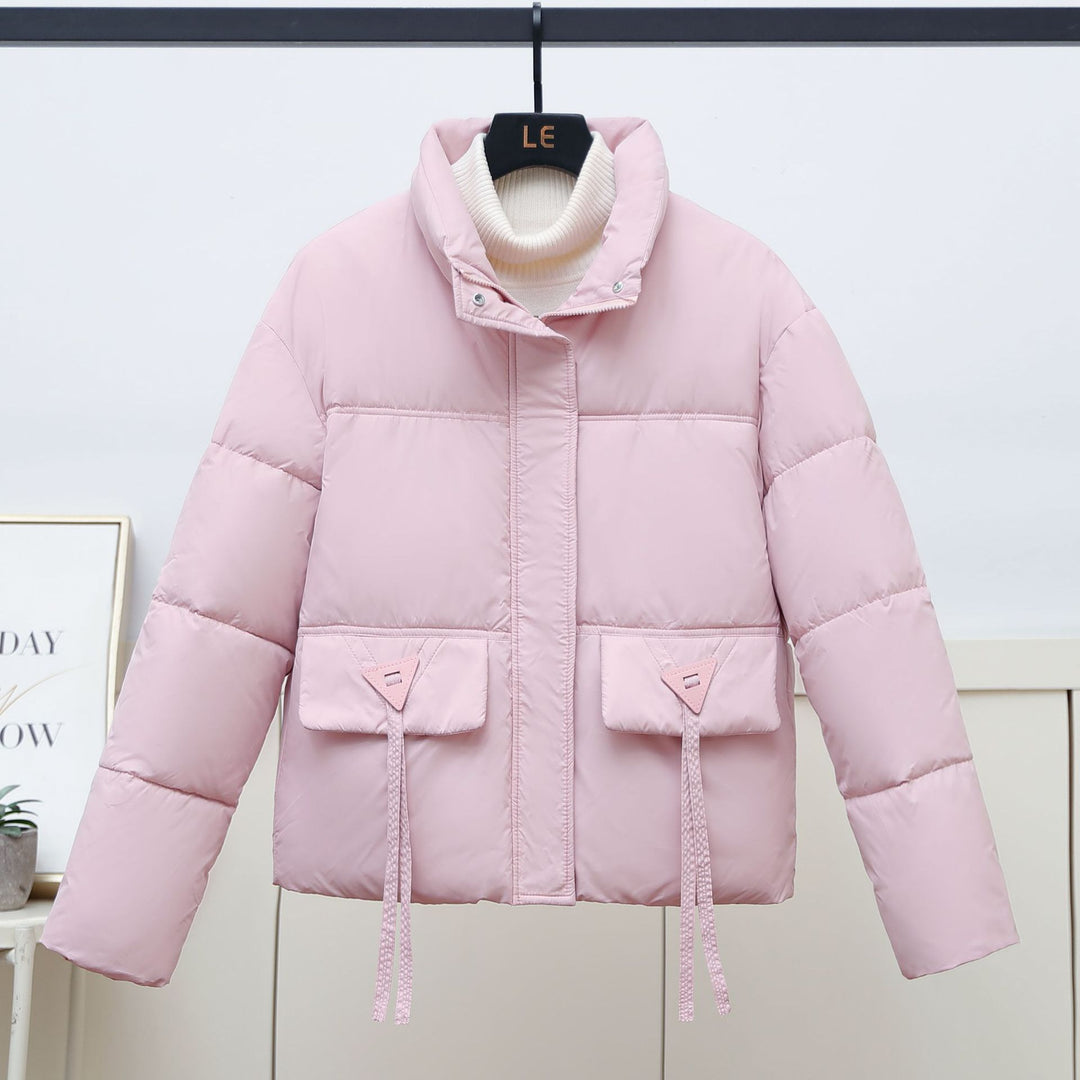 Quilted transitional jacket for women with high collar and practical modern pockets Lune London