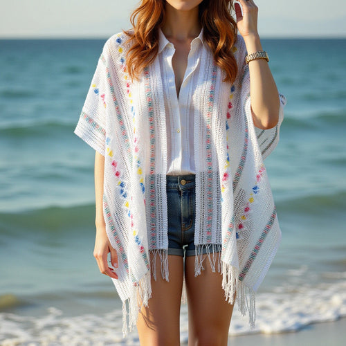 Ladies casual poncho with fringe details and a chic and stylish colorful pattern