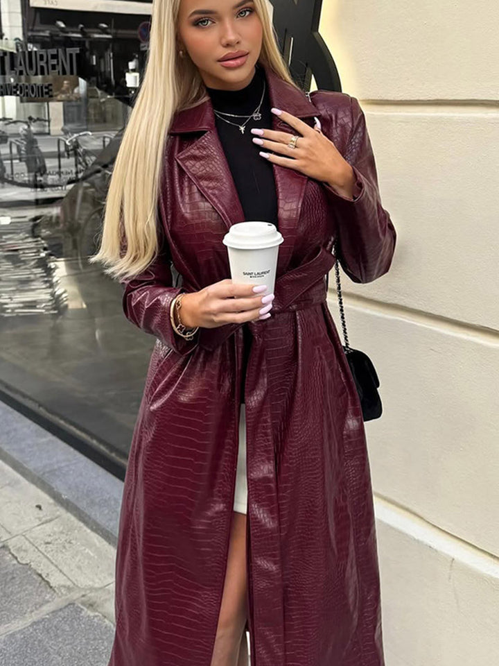 Women's long coat made of faux leather with crocodile embossing and waist belt Amarae