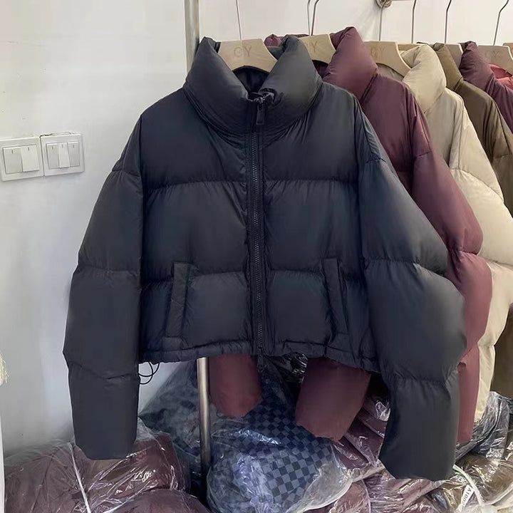 Ladies short functional quilted jacket with high collar and side pockets Amarae