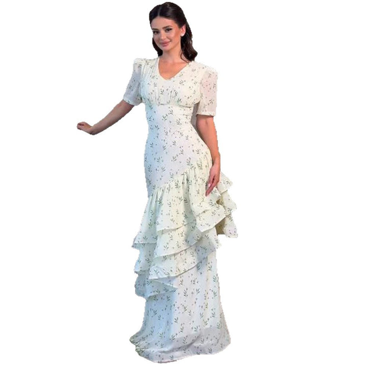 Women’s maxi dress in vintage-romantic style with asymmetric ruffles and puff sleeves Amarae
