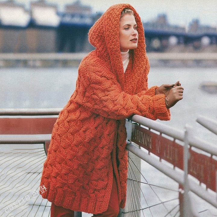 Thick knitted coat for women with hood and decorative cable knit pattern Lune London