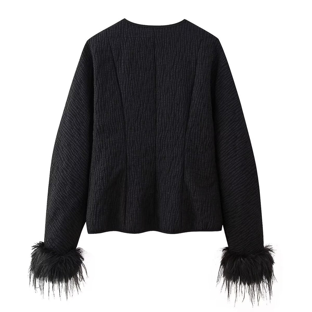 Fashion quilted jacket for women with a refined tied belt and elegant fox fur sleeves Lune London