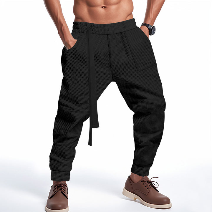 Men's casual fabric trousers with functional pockets and practical drawstring Chic and style