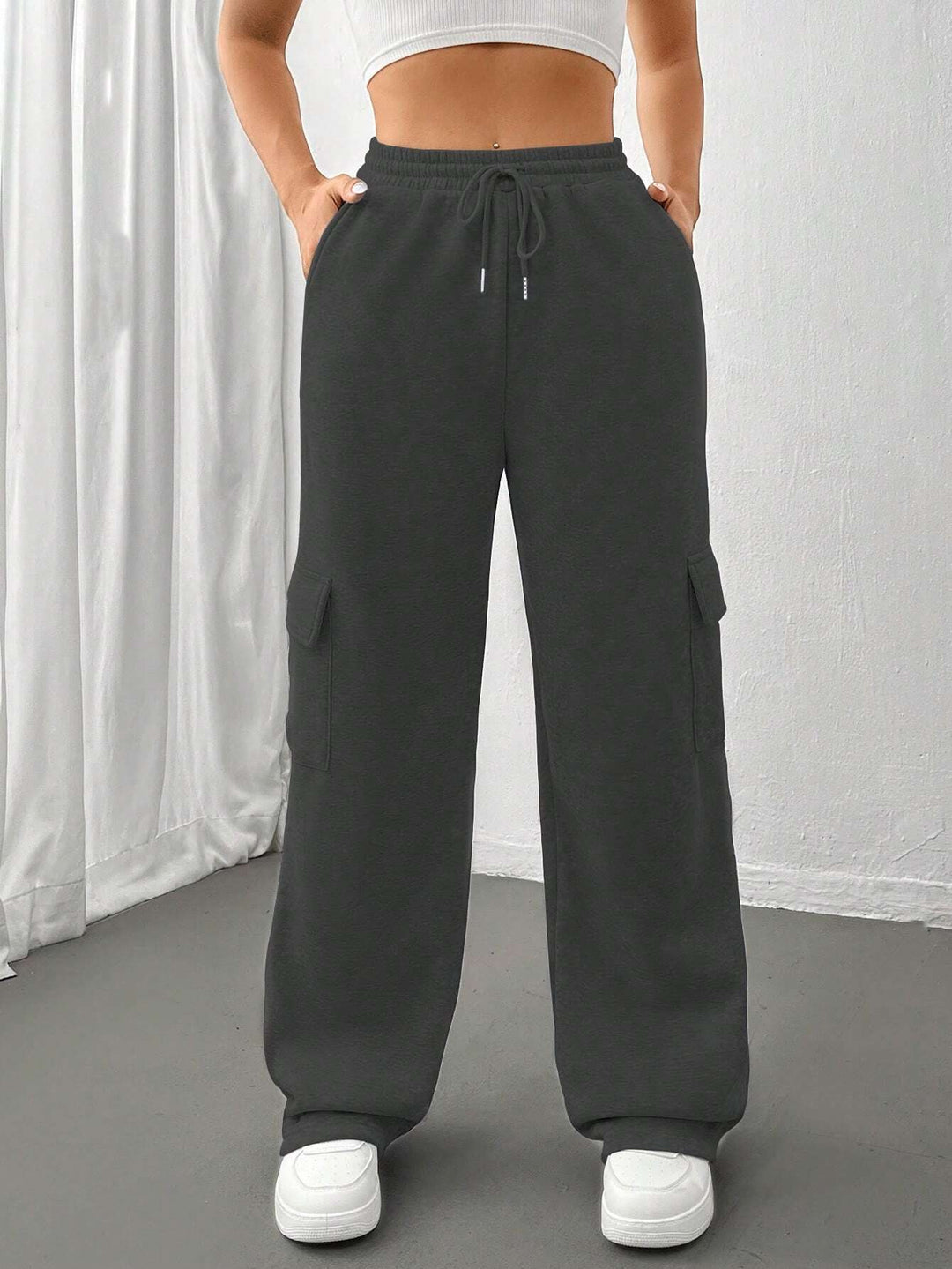 Ladies cargo jogging pants with high elastic waistband, drawstring, and wide leg Amarae