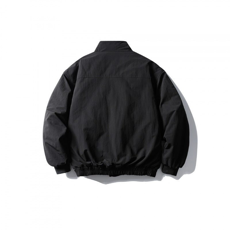 Unisex short boxy isolation jacket with diagonal flap pocket detail and elastic hem Amarae