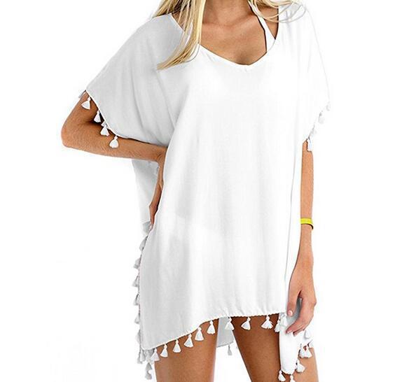 Tuniques de plage pour femmes avec une structure aérienne et des pompons ludiques Chic & Stil