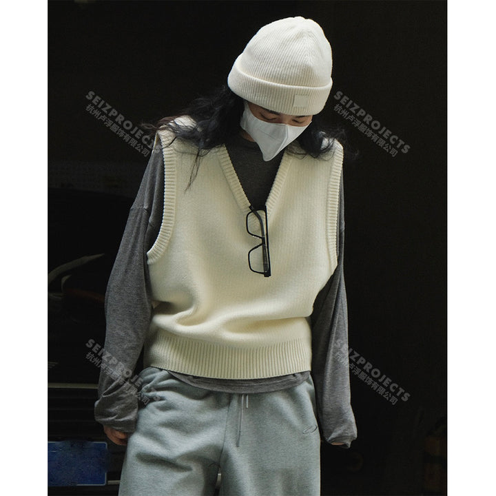 Women's sleeveless knitted vest in boxy cut with deep V-neckline and ribbed hem Amarae