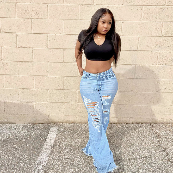Women's high-waisted flared jeans with large rips and extra wide hem Amarae