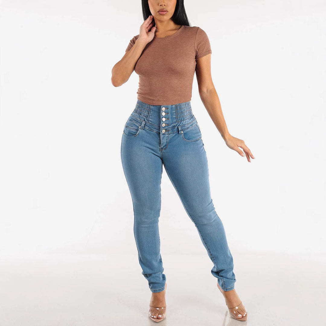 High-waisted women's jeans with elastic belt and decorative button closure Chic & Stil