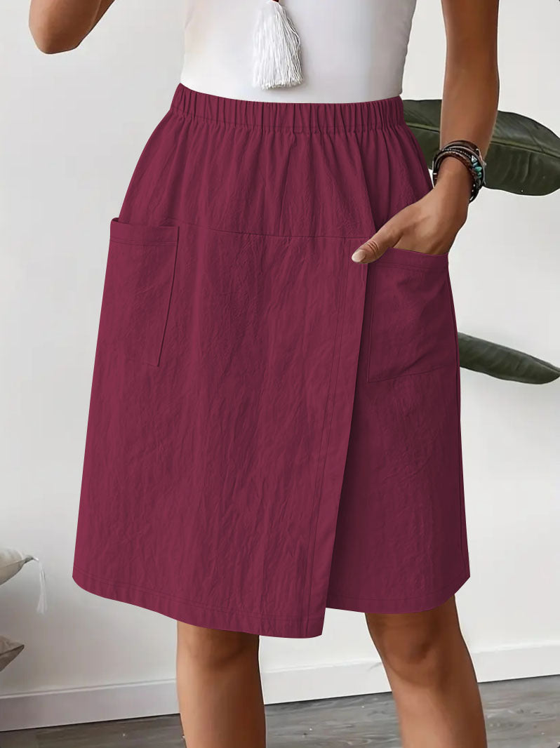 Mid-length wrap skirt for women with elastic waist and practical pockets Lune London