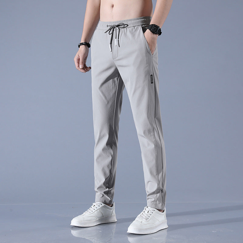 Men's sports pants with adjustable drawstring and zippered pockets on the sides Lune London