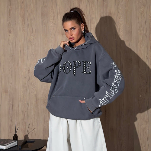 Ladies oversized hoodie with striking stone decoration and creative prints on the sleeves Amarae
