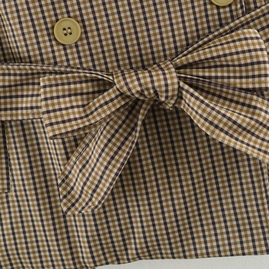 Women's short trench coat in checkered pattern with waist belt, shoulder straps and quilted inner lining Amarae