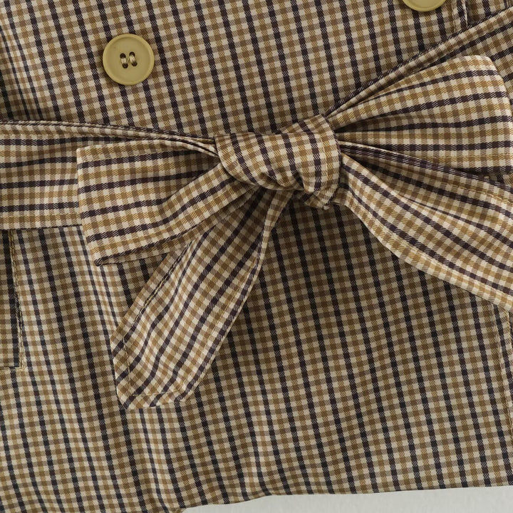 Women's short trench coat in checkered pattern with waist belt, shoulder straps and quilted inner lining Amarae