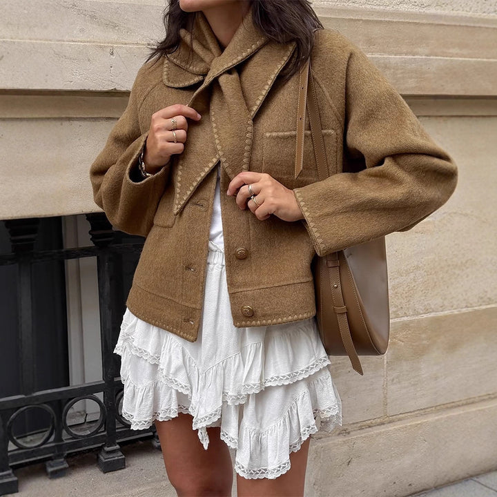 Women's short jacket made of wool blend with a suggested shawl collar, decorative seams, and boxy cropped cut Amarae