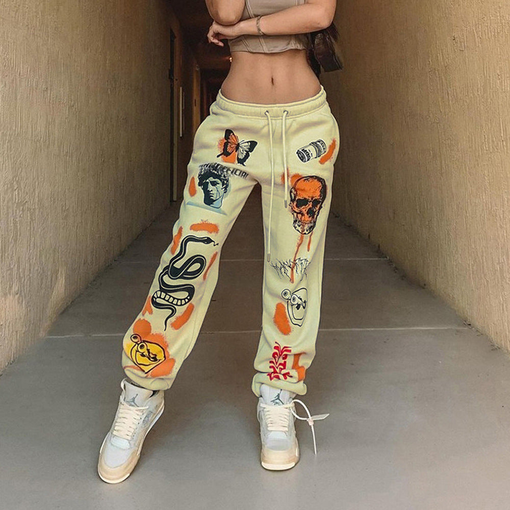 Women's graphic joggers with a high waistband, drawstring, and streetwear prints Amarae