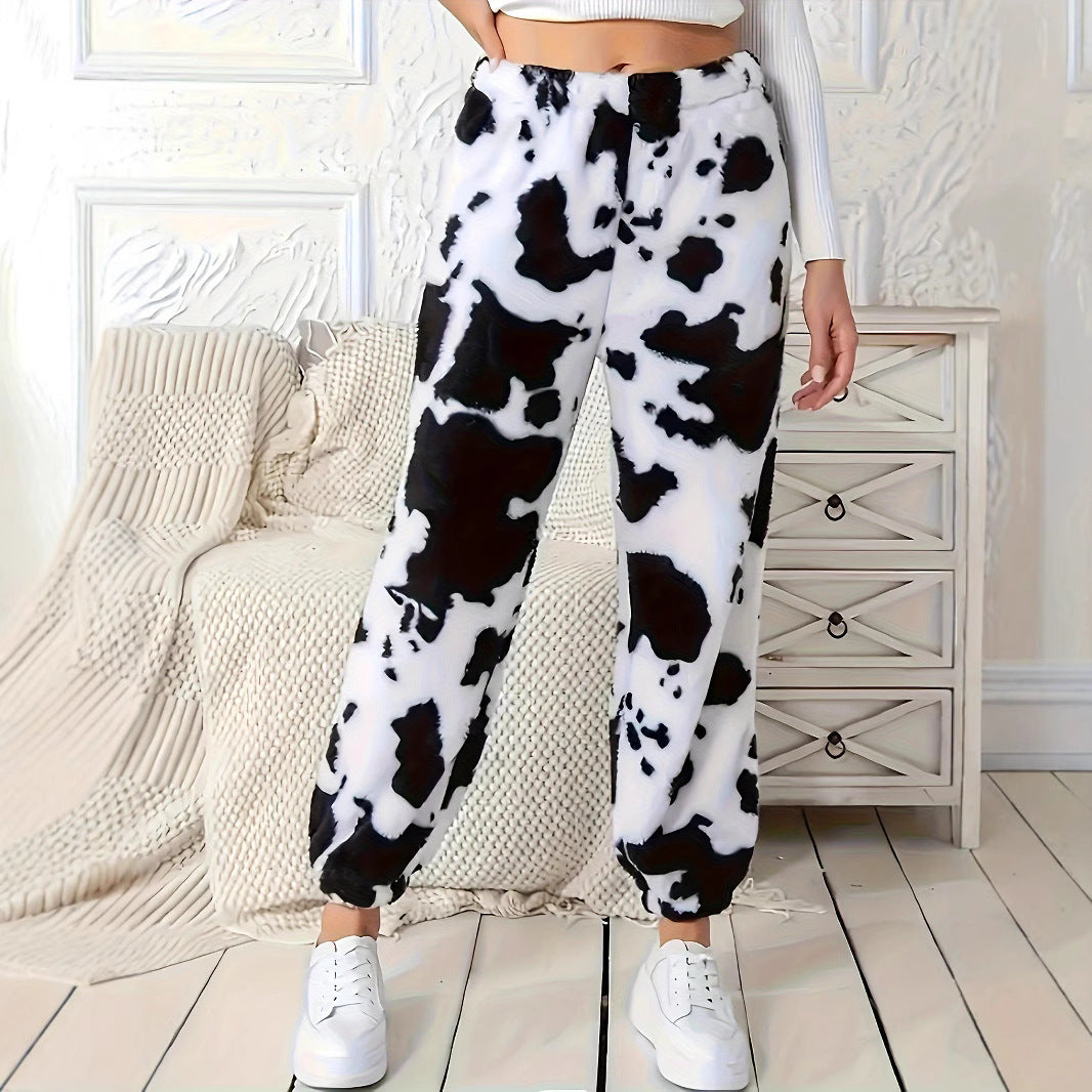 Ladies plush pants with a trendy cow spot pattern and elastic waist Lune London