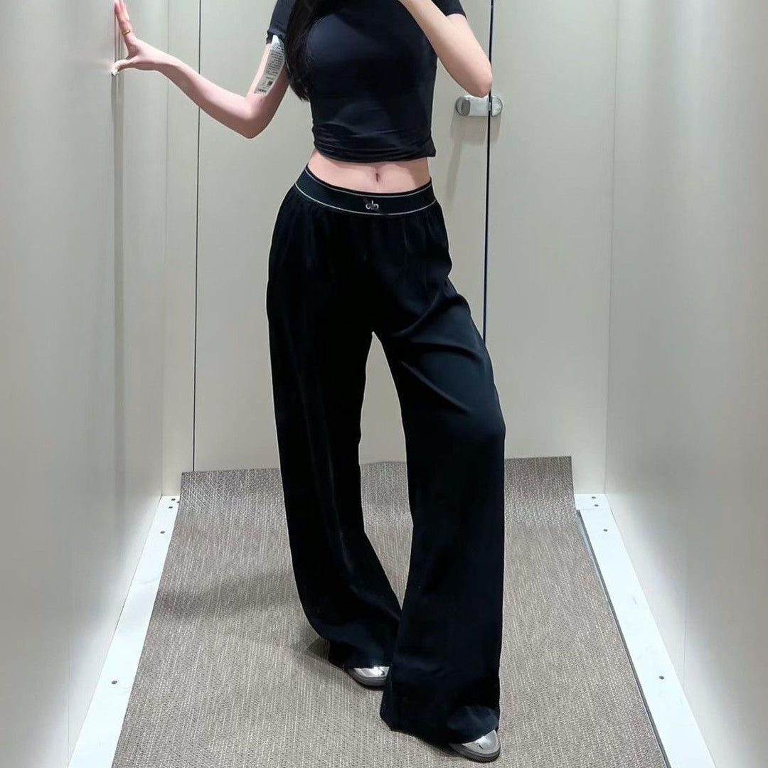 Women's wide sports trousers with elastic waistband and side pockets Chic & Stil