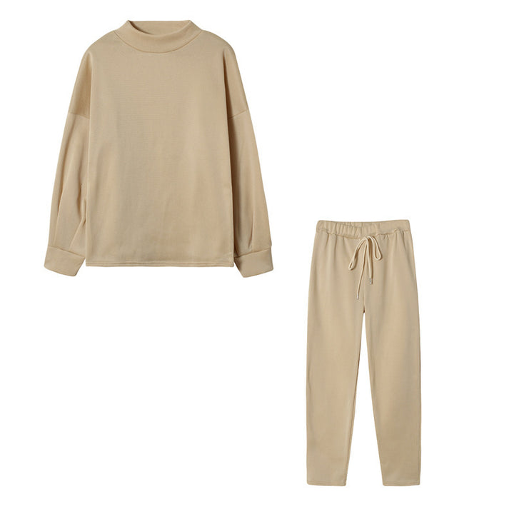 Ensemble de survêtement pour femmes avec une coupe moderne, un haut à col montant et un pantalon élastique Chic & Stil
