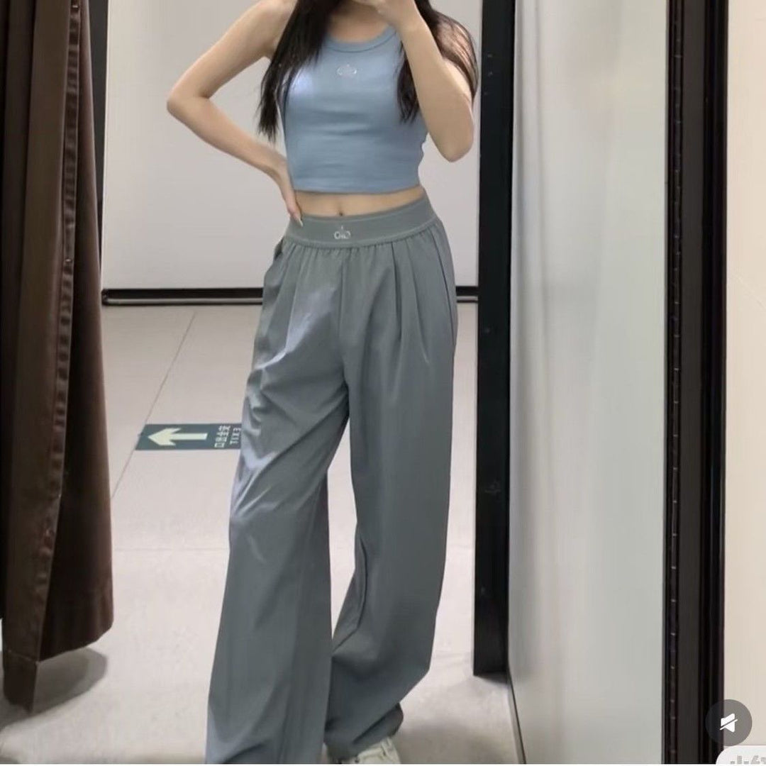 Women's wide sports trousers with elastic waistband and side pockets Chic & Stil
