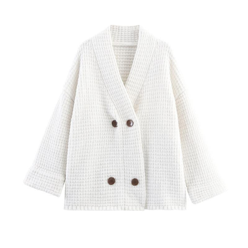 Ladies quilted knit with decorative button closure and high collar Lune London