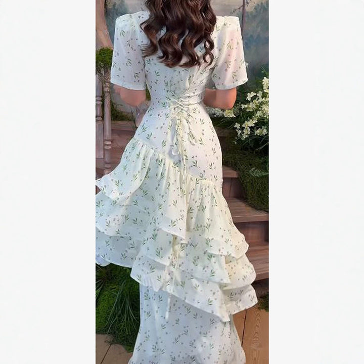 Women’s maxi dress in vintage-romantic style with asymmetric ruffles and puff sleeves Amarae