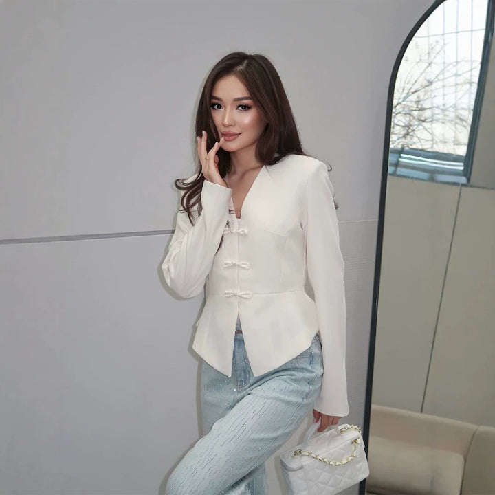 Women's peplum blazer with mandarin-like neckline and decorative knot fastenings Amarae