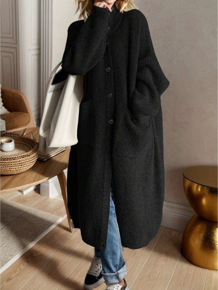 Trendy knitted jacket for women with generous pockets and chic button detail