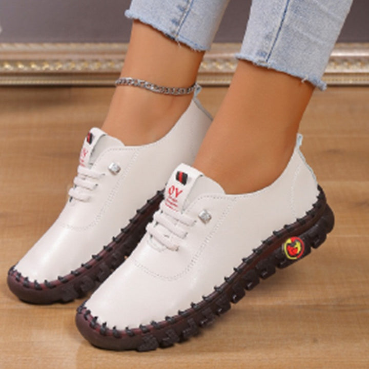 Women's lightweight, soft slip-on with hand-stitched rubber sole and elastic lacing Amarae