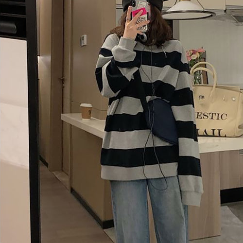 Women's casual knit sweater with wide stripes and cozy oversized fit