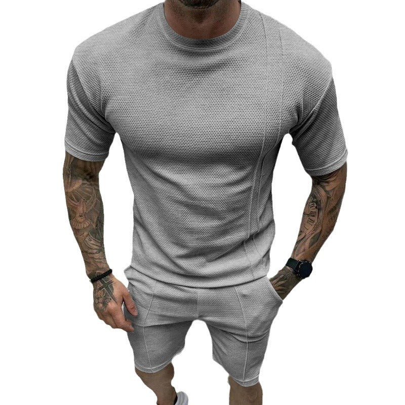 Men's short sleeve sports set with an innovative textured design and practical side pockets Lune London