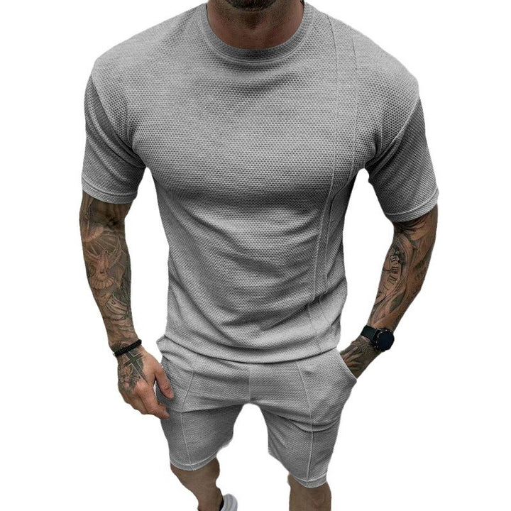 Men's short sleeve sports set with an innovative textured design and practical side pockets Lune London