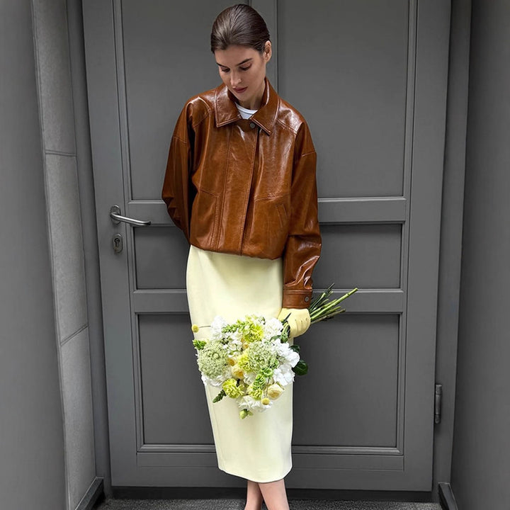 Women's short blazer made of vegan smooth leather with boxy silhouette and concealed snap button placket Amarae