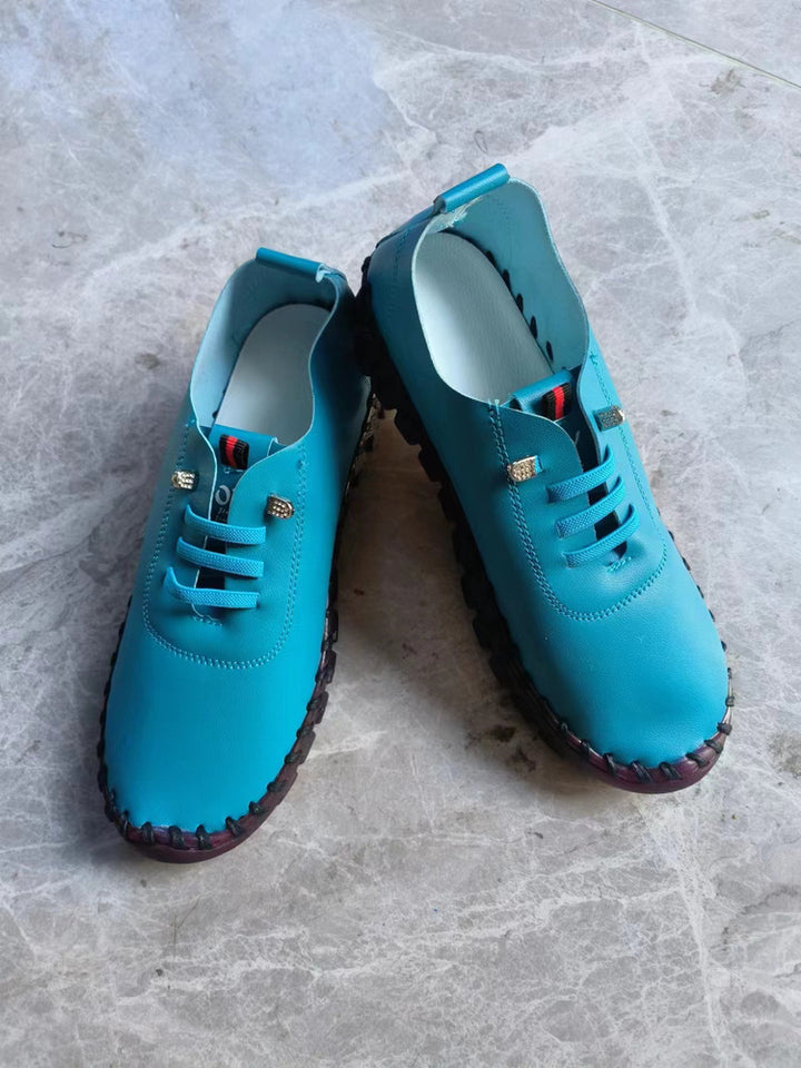 Women's lightweight, soft slip-on with hand-stitched rubber sole and elastic lacing Amarae