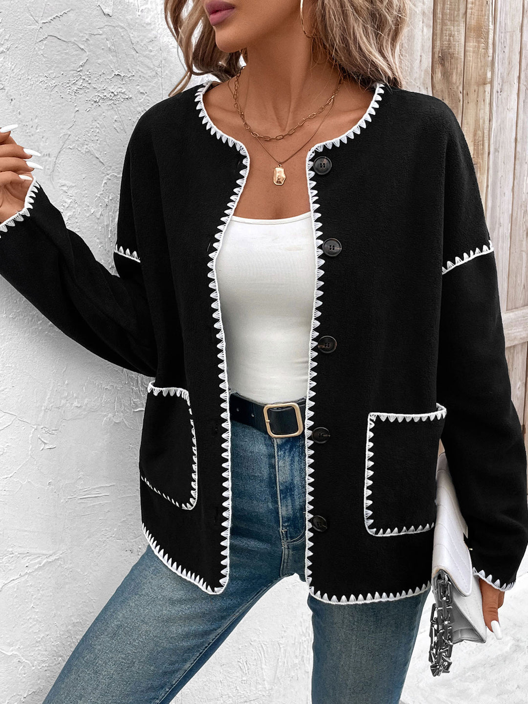 Fashion knitted jacket for women with decorative contrasting trim and large pockets Lune London