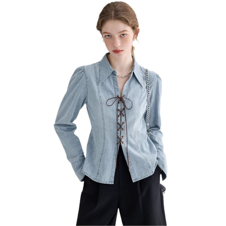 Ladies' jeans blouse with playful lacing details and elegant cut