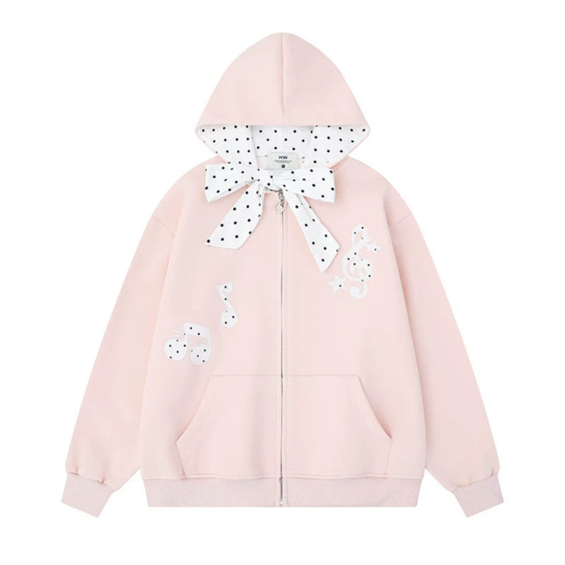 Women's hooded sweat jacket with polka dot hood lining, decorative bow, and music notes motif Amarae