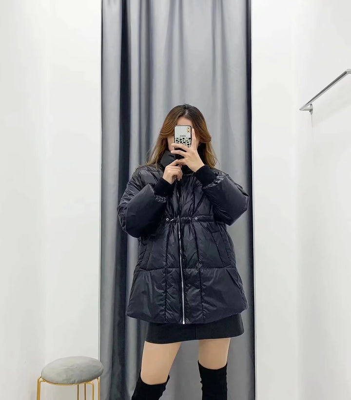 Quilted transition jacket for women with high collar and practical side pockets Lune London