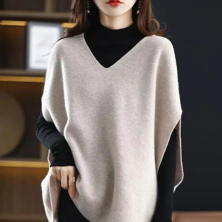 Knitted poncho for women with V-neck and chic elegant silhouette