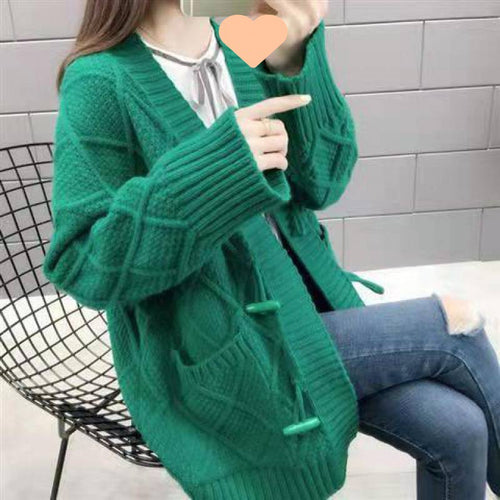 Knitted cardigan for women with a cable design and structures Amarae