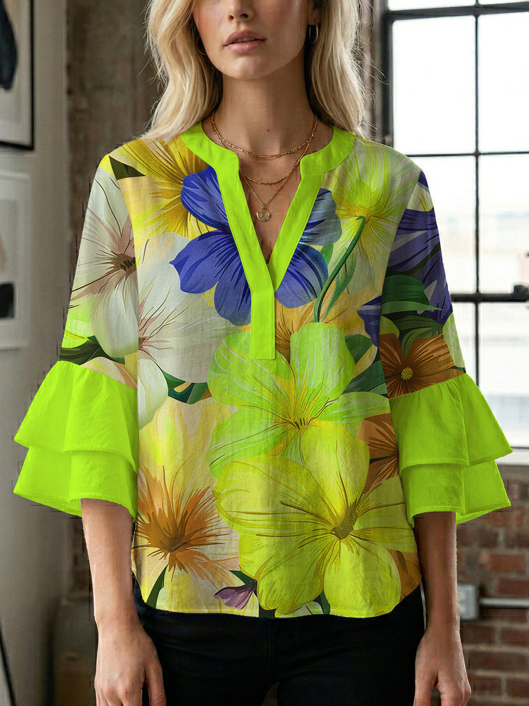 Women’s blouse with voluminous ruffled sleeves and floral pattern Lune London