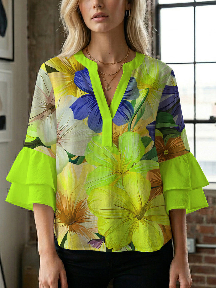 Women’s blouse with voluminous ruffled sleeves and floral pattern Lune London