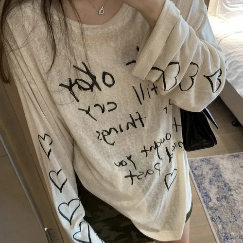 Women's casual oversized top with off-shoulder design and artistic lettering Chic & Stil