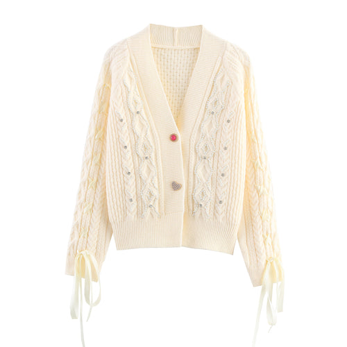 Knitted jacket for women with cable pattern and decorative button details Amarae