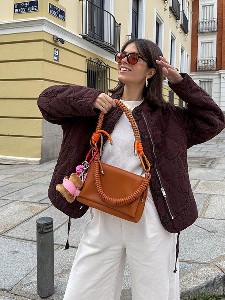 Women's shoulder bag made of synthetic leather with braided handle and spiral-shaped front grip Amarae